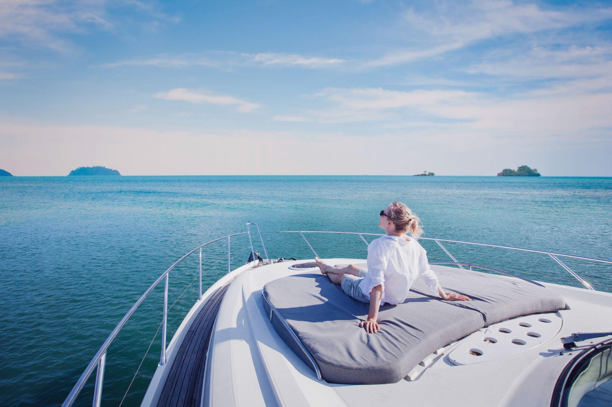 beautiful woman enjoying luxurious yacht cruise