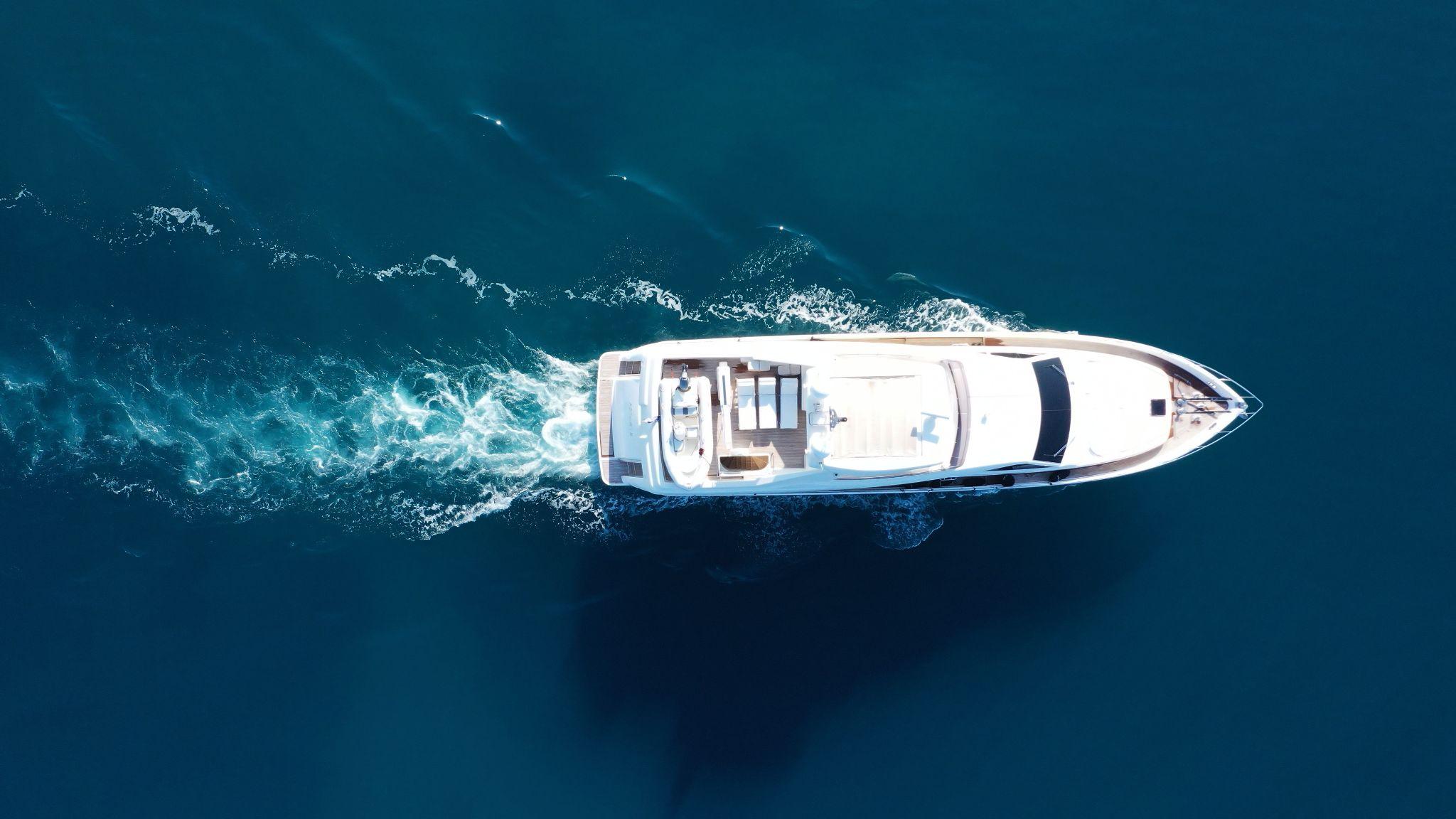 Aerial view of luxury yacht cruise in mediterranean deep blue sea