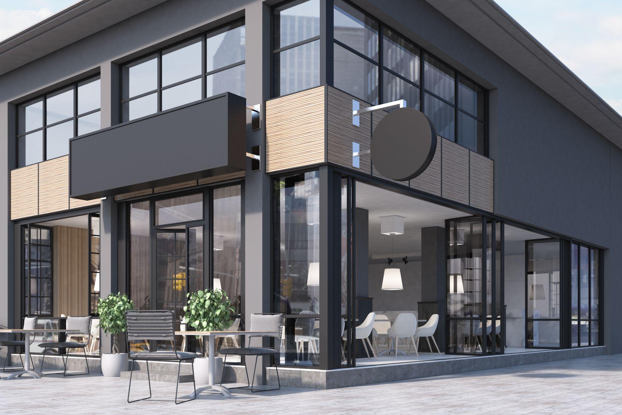 Modern black and gray cafe interior with a round and a rectangular signs, wooden tables and metal chairs